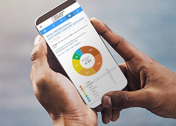 hands holding a mobile phone looking at an energy website