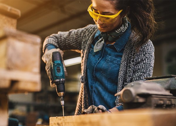 Woman using power drill